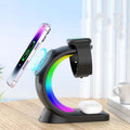 4-in-1 Wireless Charging Station with RGB lighting charging phone and smartwatch on a desk